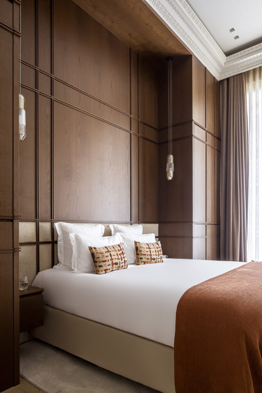 Bedroom with dark walnut panelling