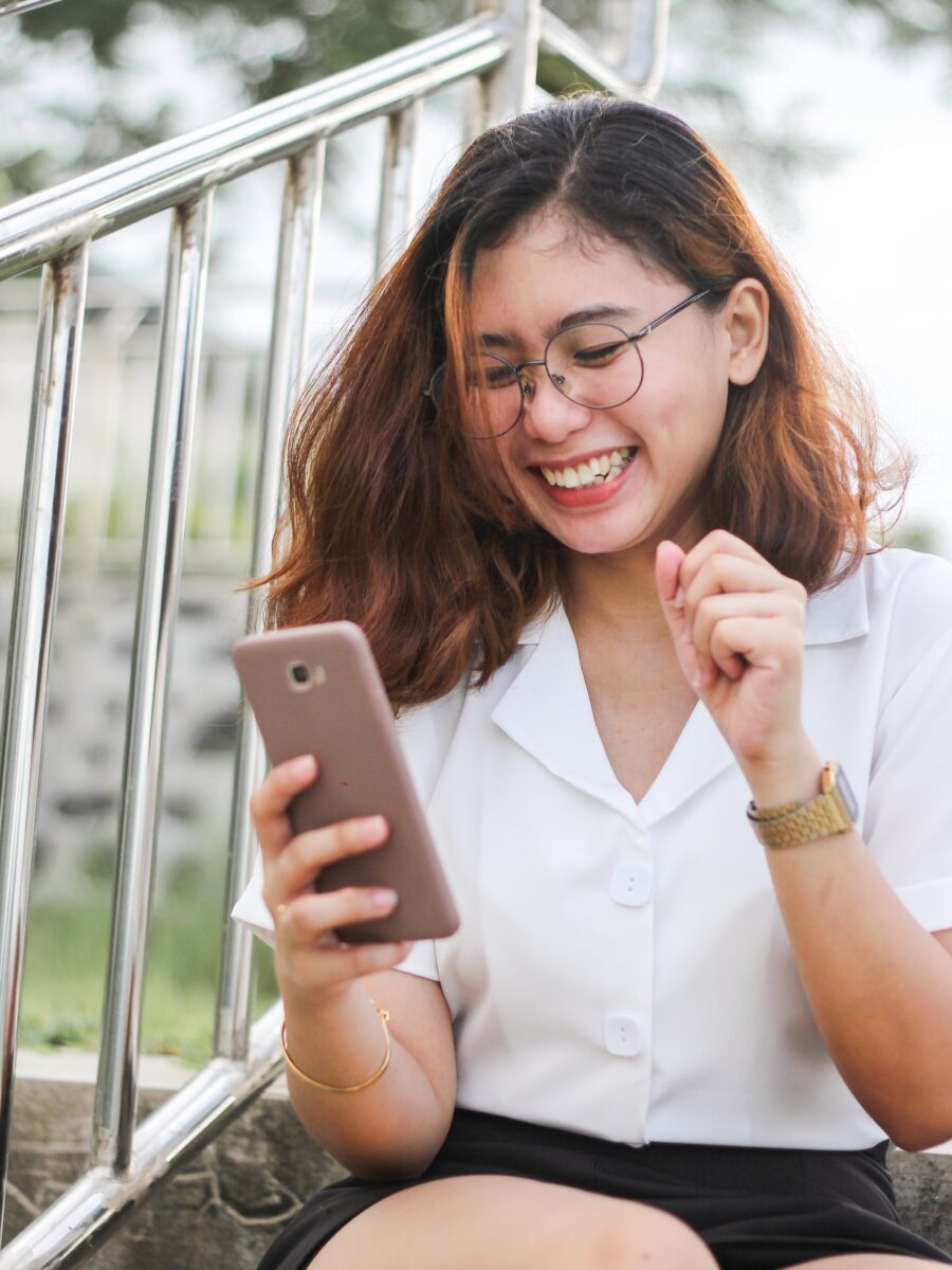 A woman looking at a mobile phone.