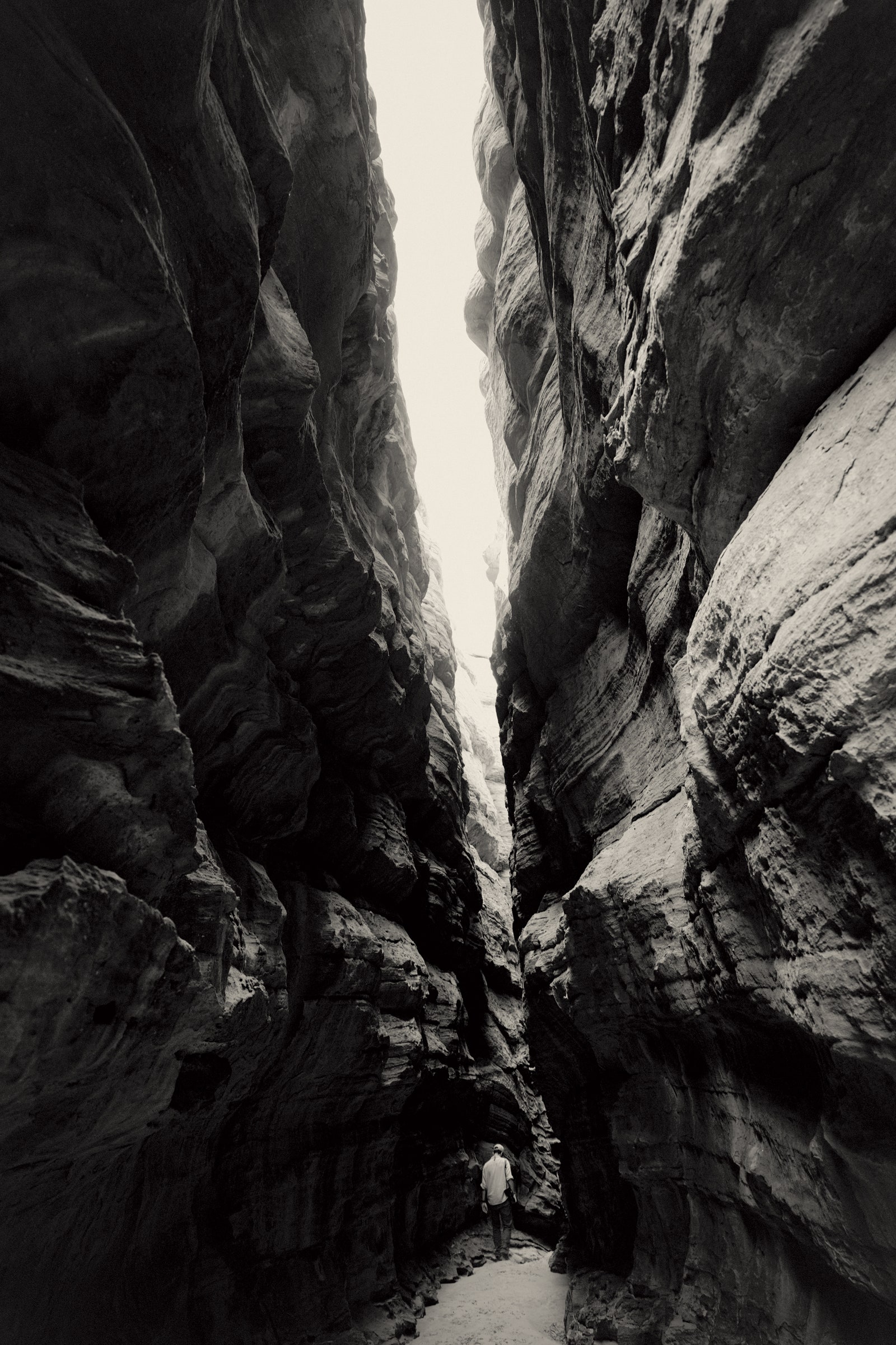 Image may contain Mountain Nature Outdoors Valley Rock Canyon Person Cliff and Cave