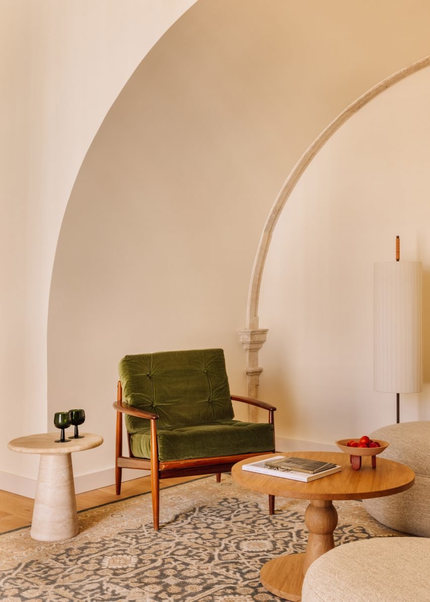 Green chair in minimal interior by Post Company