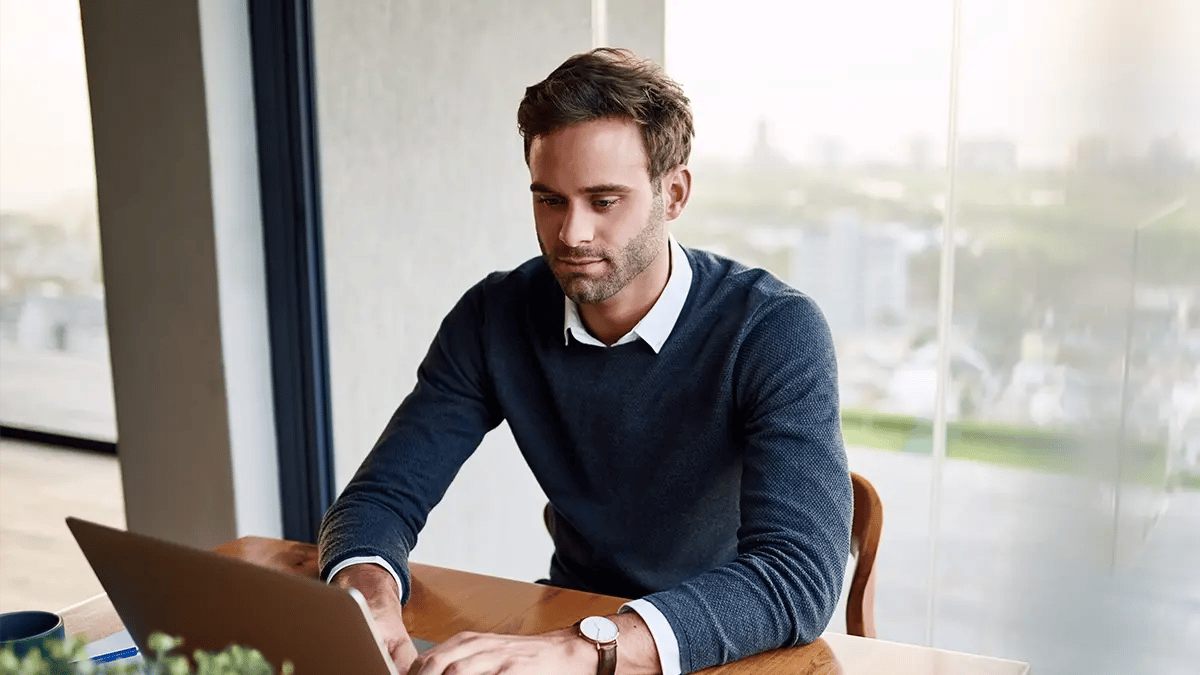 Working man typing on his laptop.