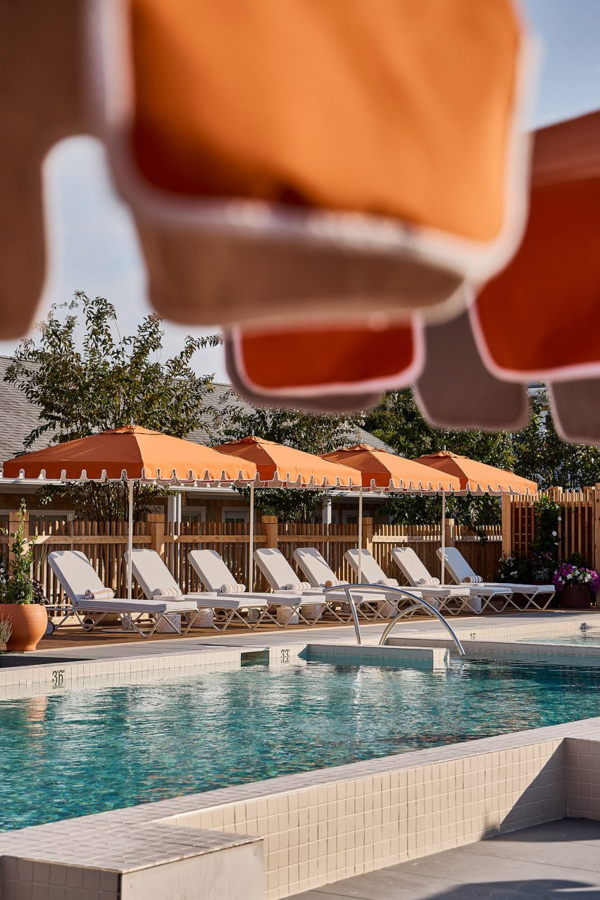 Pool with orange umbrellas