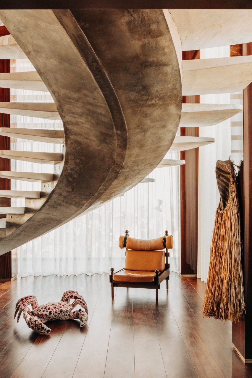 Swooping staircase with floating treads based on an Oscar Niemeyer design