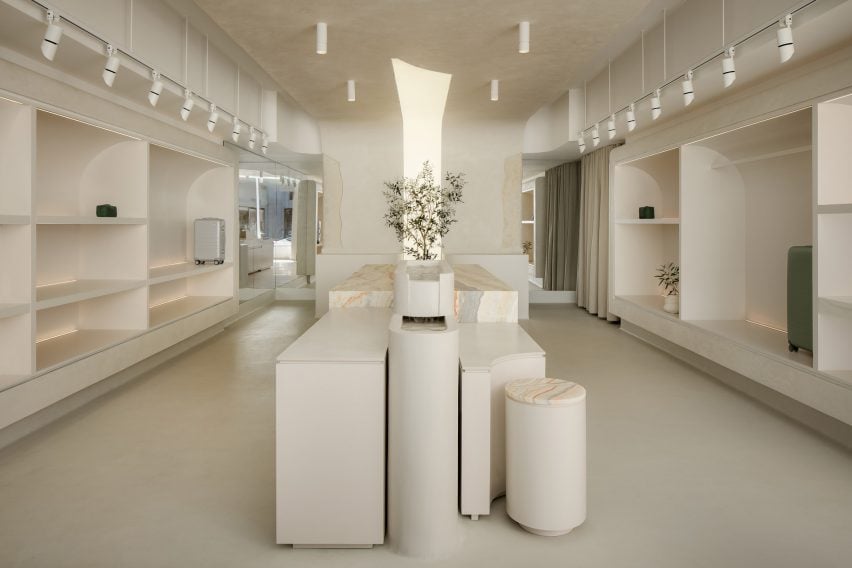 Minimalist store interior with a central water feature