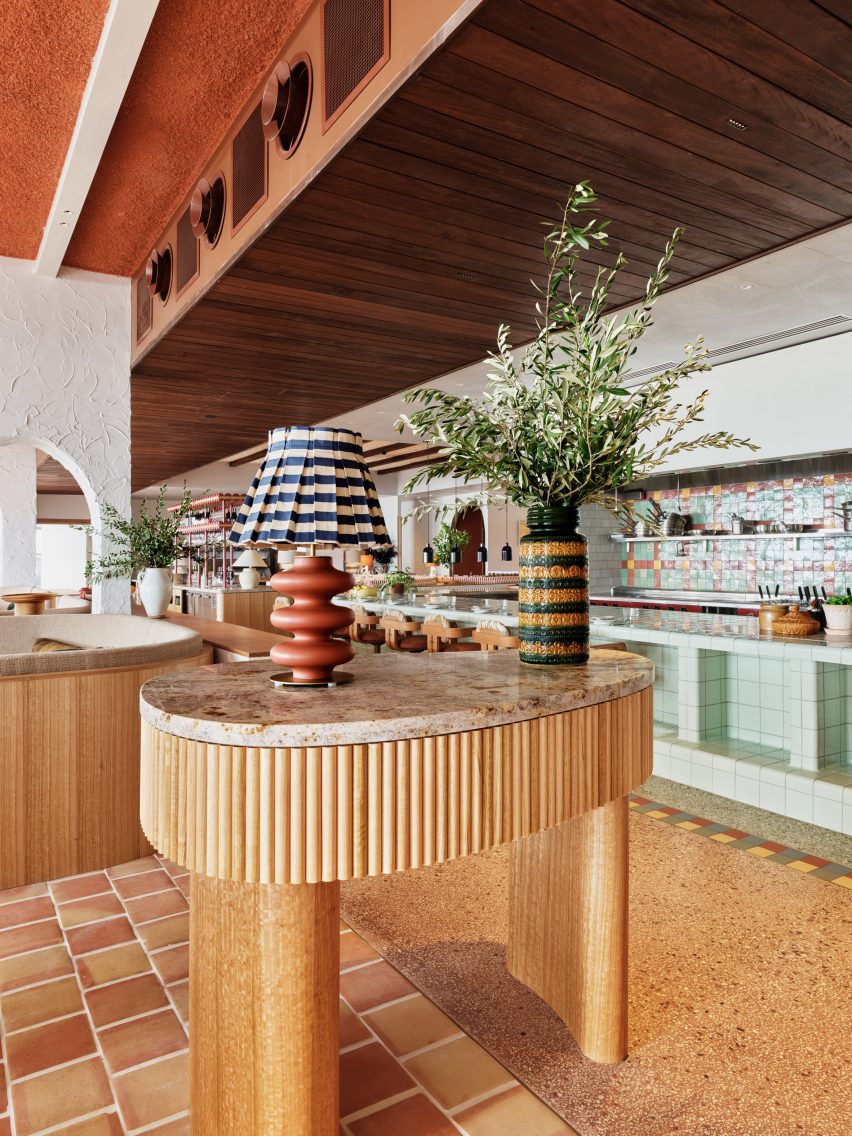 Timber reception desk topped with lamps