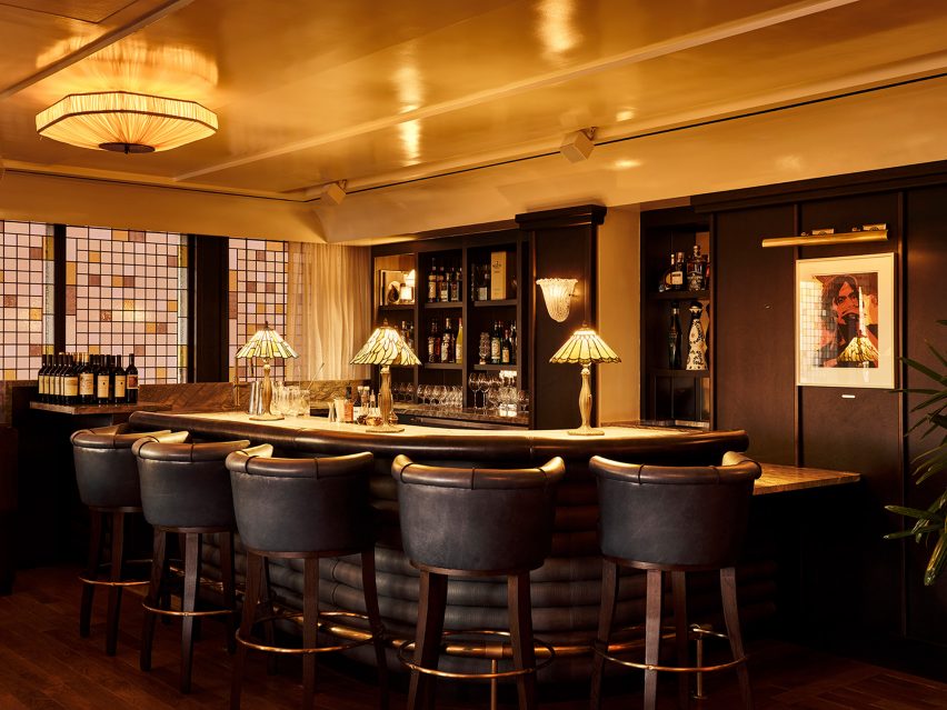 Stained-glass windows behind a bar