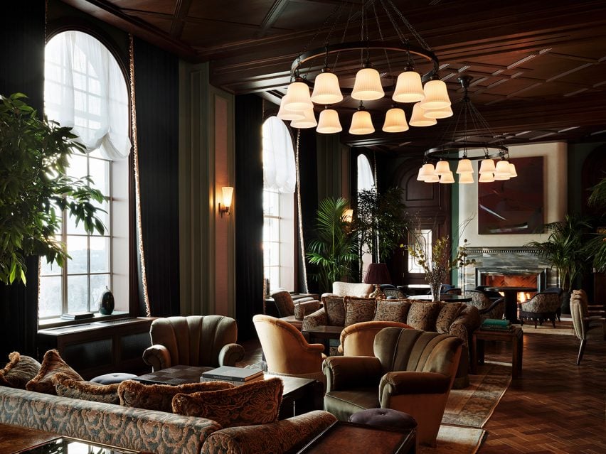 Parlor with tall ceilings and comfortable furniture