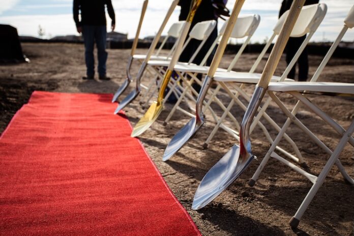 Construction ground breaking ceremony with red carpet