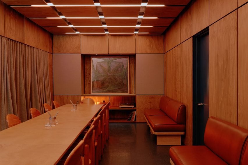 Semi-private dining and listening room lined with plywood panels