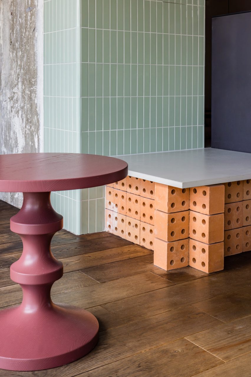 Brick seating in hotel renovation by Studio Aisslinger