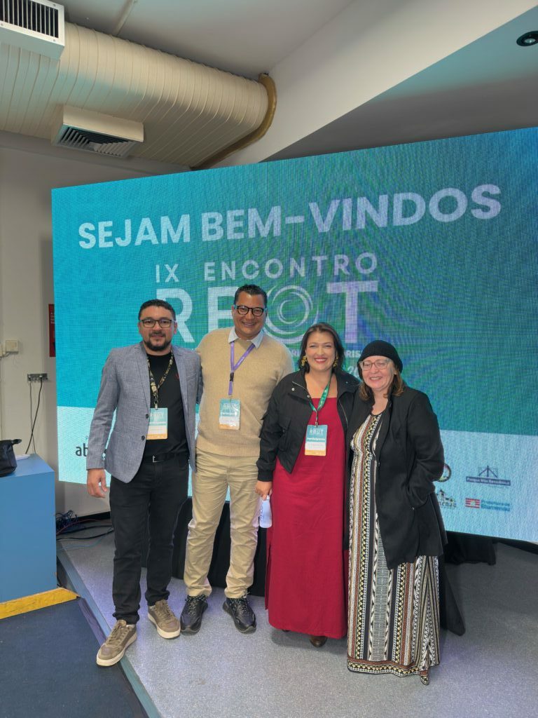 The panelists posing for a photo together at the event