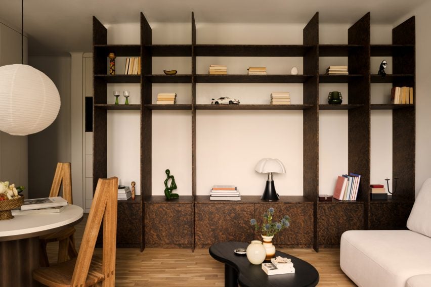 Floor-to-ceiling shelving unit in a mid-century Warsaw apartment