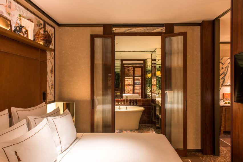 Bedroom with bed leading through to opening doors en suite