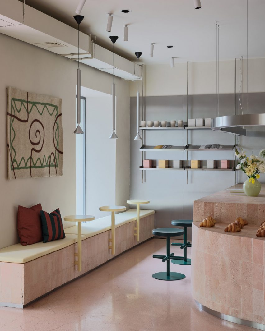 Built-in bench seating with yellow coffee tables