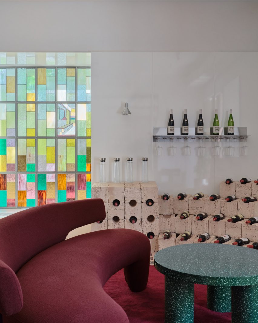 Stained glass window and burgundy seating