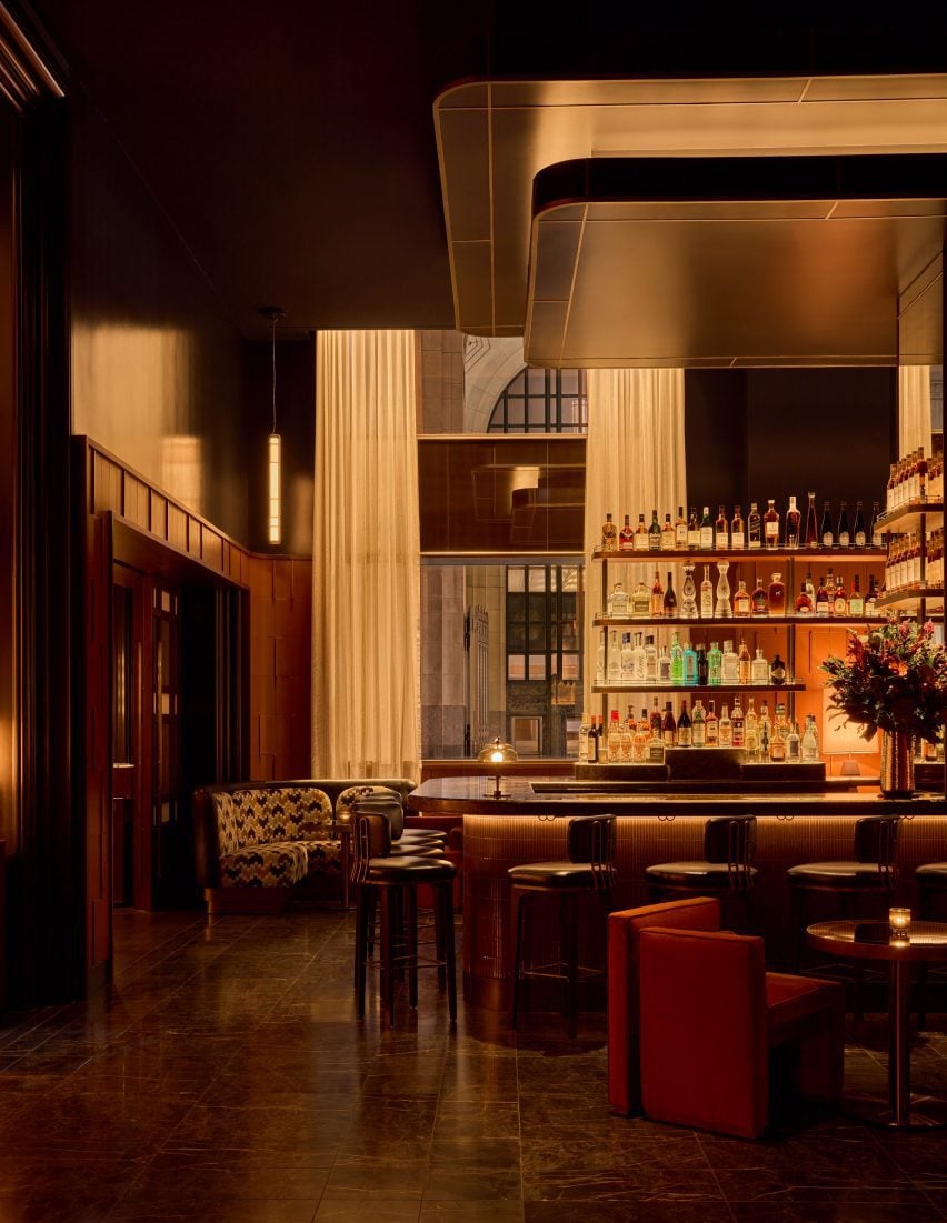 Bar area with tall ceiling and low lighting