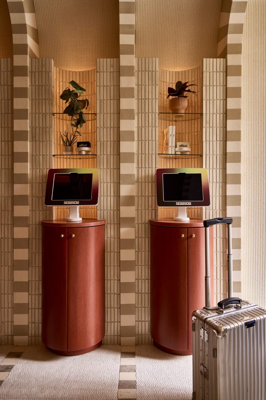 Self-check in machines on wooden podiums
