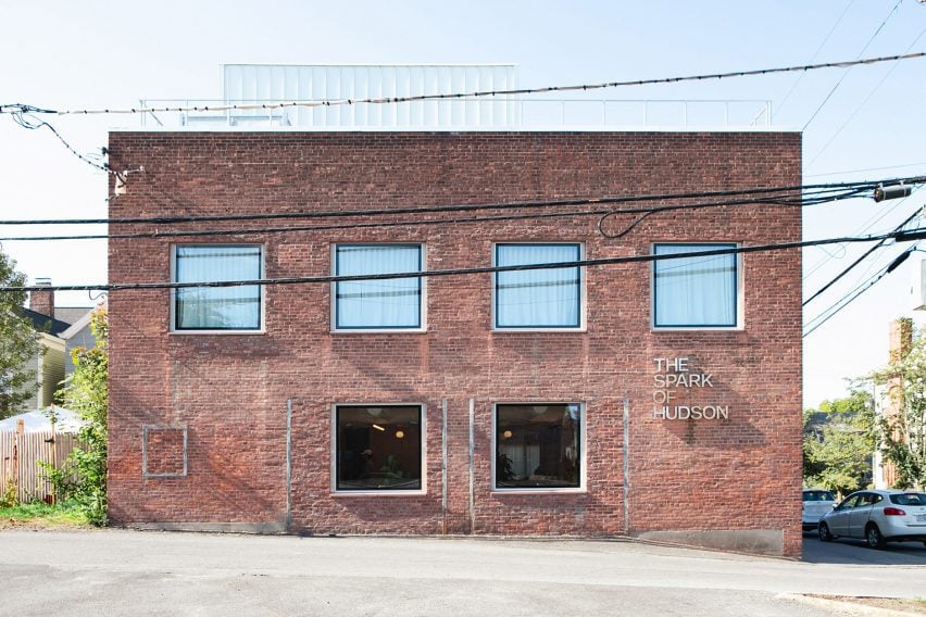 Exterior of a two-storey brick building with square windows
