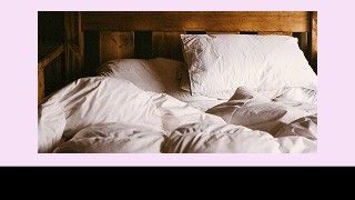 Banner ad on a pink background with bold slogans left ('Room revenue is your baseline') and right ('Not your business model'), a centered photo of an unmade bed, and a black bottom bar showing the MEWS logo and a 'Get the metrics that matter guide' callout.