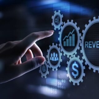 Hand interacts with glowing gears representing revenue and growth in a digital analytics interface.