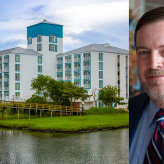 Lakeside white hotel with blue accents and a wooden walkway, beside a headshot of a smiling man in a blue suit.