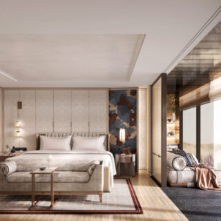 Luxurious hotel suite with a king bed, seating area, open wardrobe on the left, and large glass walls with a scenic view.