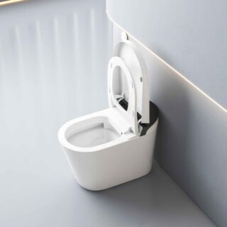 White modern toilet with open lid in a bright, minimalist bathroom featuring a wall with angled lighting strip nearby.