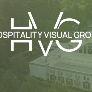Hospitality Visual Group (HVG) logo over a green-tinted aerial view of a building complex.
