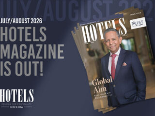 Announcement banner for Hotels Magazine July/August 2026 with a stacked magazine cover showing a man in a navy suit and red tie on the front.