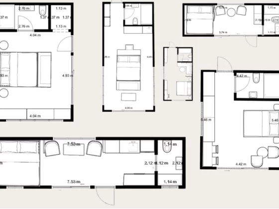 Floor plan of a multi-room residence showing bedrooms, bathrooms, and hallways with labeled measurements.