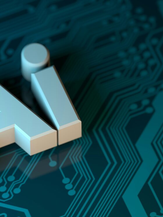 3D white letters AI set against a blue circuit-board background signaling artificial intelligence