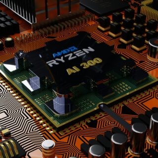 Close-up of a computer motherboard highlighting a black processor labeled 'AMD RYZEN AI 300' amid orange circuit traces and components like capacitors and heatsinks.