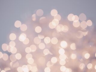 Soft pink and white bokeh lights blurred into a dreamy background, conveying warmth and calm no.1