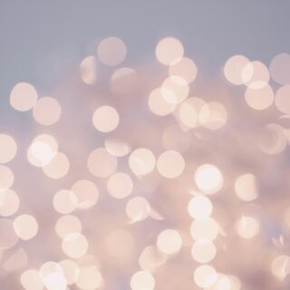 Soft pink and white bokeh lights blurred into a dreamy background, conveying warmth and calm no.1