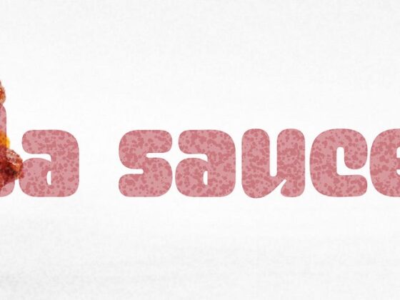 Close-up of a tall cheeseburger with sesame bun, cheese, and sauce on the left, pink 'a sauce' text on a white background.
