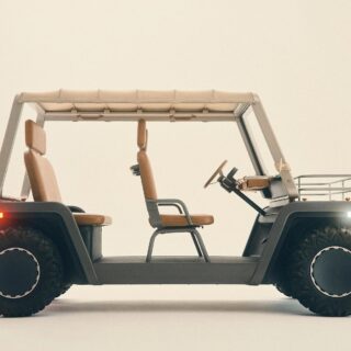 Side profile of a beige four-seat golf cart with tan upholstery, a beige canopy, and large rugged tires.