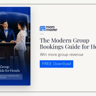 Advertisement showing a blue book cover titled 'The Modern Group Bookings Guide for Hotels' beside a promotional text and a 'FREE Download' button on the right.