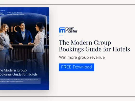 Advertisement showing a blue book cover titled 'The Modern Group Bookings Guide for Hotels' beside a promotional text and a 'FREE Download' button on the right.