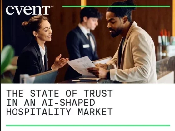 Cvent cover: two staff members discuss documents at a front desk, with the report title 'The State of Trust in an AI-Shaped Hospitality Market'.
