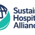 Sustainable Hospitality Alliance logo with a globe cradled by pink and teal hands, next to the organization name.