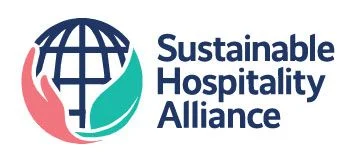 Sustainable Hospitality Alliance logo with a globe cradled by pink and teal hands, next to the organization name.