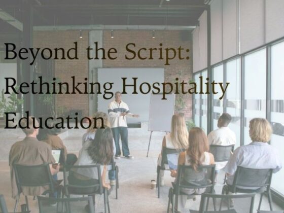 Presenter addresses an audience in a bright, modern space with large windows; overlay text reads 'Beyond the Script: Rethinking Hospitality Education'.