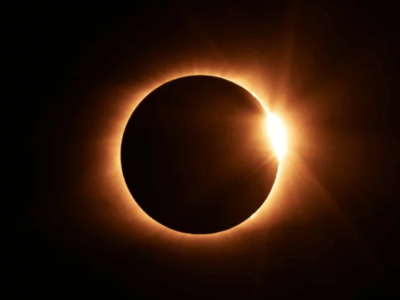 Solar eclipse: the Moon blocks the Sun, leaving a bright solar corona around a dark disk.