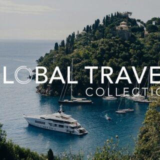 Seaside cove with yachts anchored near a tree-covered hill; large overlay text reads 'GLOBAL TRAVEL COLLECTION'.