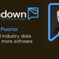 Podcast banner for The Turndown featuring Simone Puorto—'The hotel industry does not need more software.' Portrait of a man in a suit inside a blue speech-bubble frame, Cloudbeds logo bottom-right.