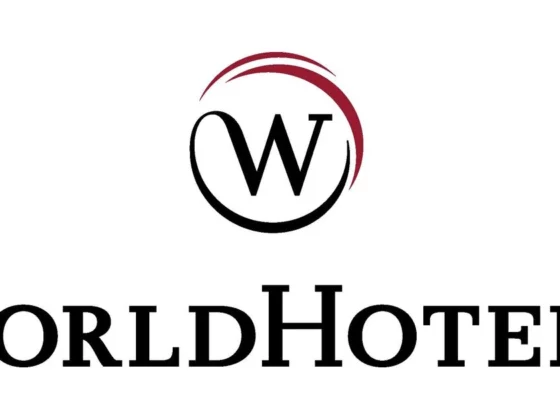 WorldHotels logo: black W inside a maroon circular swoosh, with 'WorldHotels' in large serif lettering below.