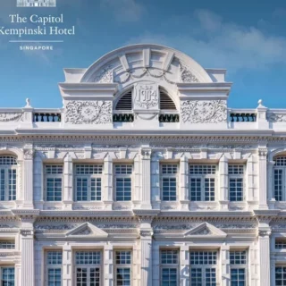Facade of The Capitol Kempinski Hotel Singapore in white, with ornate neoclassical detailing and a clear blue sky; Shiji and hotel logos appear in the top left.