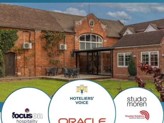 Brick event venue exterior with glass-entry doors and outdoor seating, overlaid by a blue banner and circular sponsor logos at the bottom.