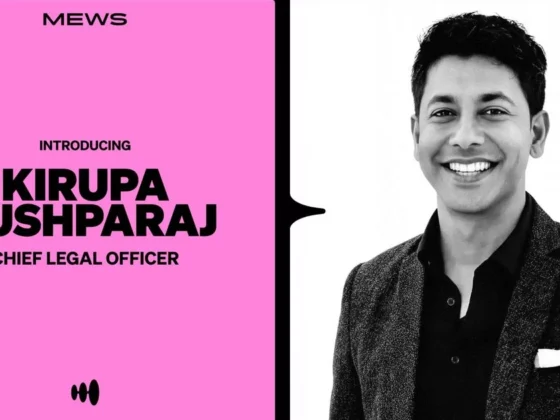 Intro card for Kirupa Pushparaj, Chief Legal Officer, on pink panel with a smiling man in a blazer beside it.