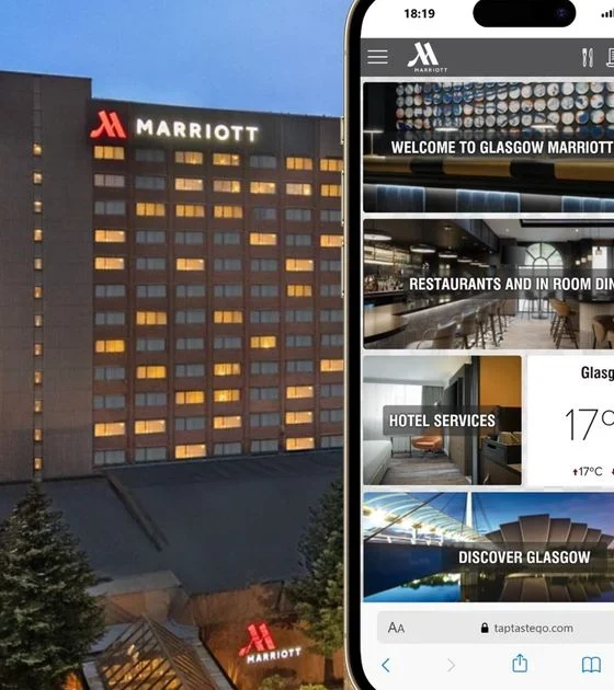 Marriott hotel exterior at dusk with a smartphone showcasing the hotel’s mobile app interface, displaying sections like Welcome, Restaurants, Hotel Services, and Discover Glasgow.